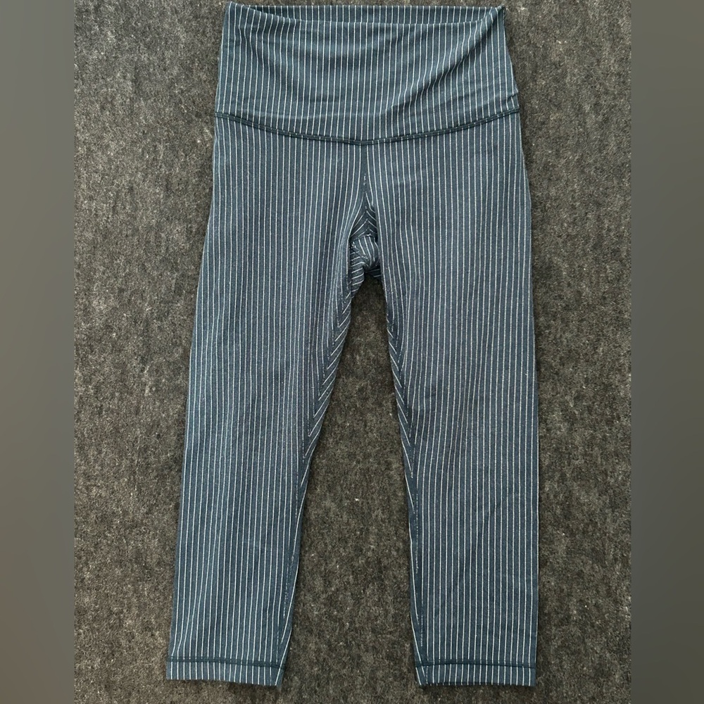 Lululemon crop leggings 21” inseam dark teal color with‎ white stripes fold down